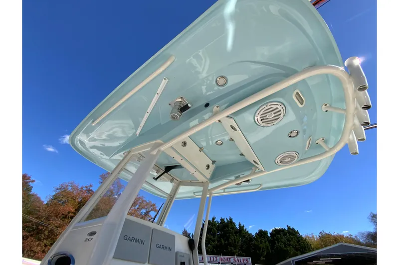 Slide: The Image of 2019 Cobia 262 Center Console boat, featuring a sleek overhead view against a clear blue sky. - 35