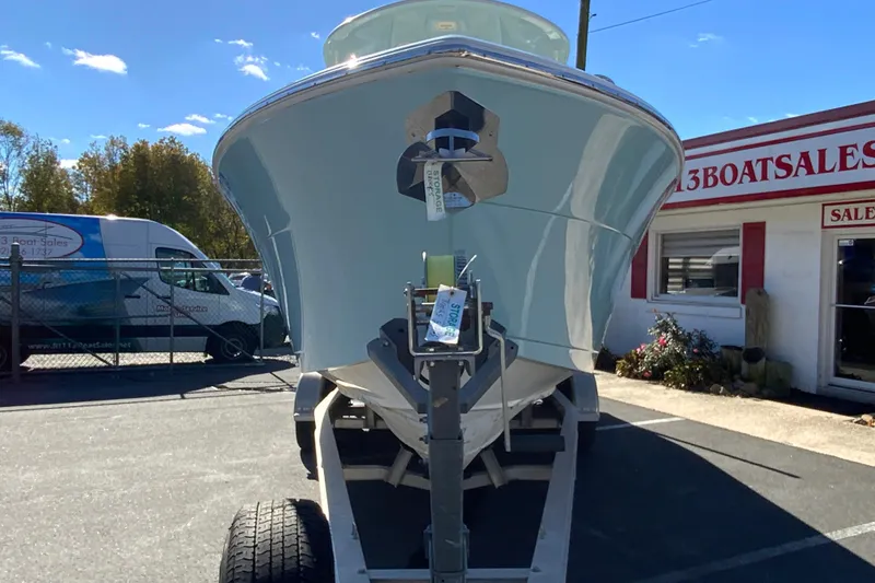 Slide: The Image of 2019 Cobia 262 Center Console boat on trailer at dealership. - 4