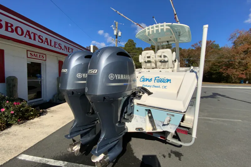 Slide: The Image of 2019 Cobia 262 Center Console boat with twin Yamaha 150 engines at dealership. - 9