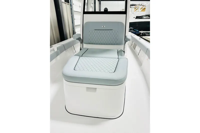 Slide: The Image of 2026 Sportsman Masters 247OE Bay Boat interior seating with quilted design. - 10