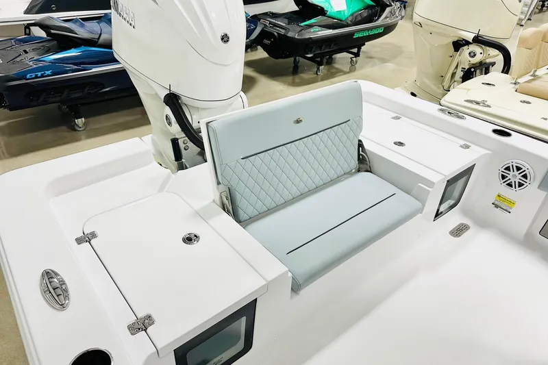 Slide: The Image of 2026 Sportsman Masters 247OE Bay Boat interior with seating and storage compartments. - 13