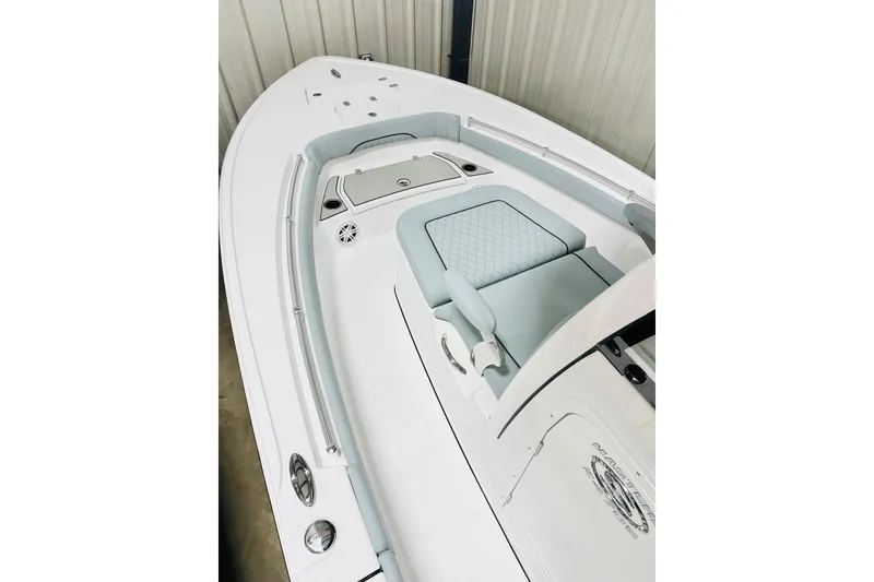 Slide: The Image of 2026 Sportsman Masters 247OE Bay Boat interior with cushioned seating and sleek design. - 8