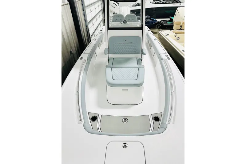Slide: The Image of 2026 Sportsman Masters 247OE Bay Boat interior with seating and storage compartments. - 9