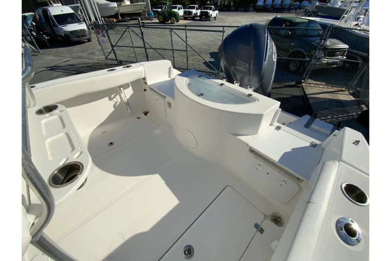 Slide: The Image of 2011 Sea Fox 256 Center Console boat interior with storage and seating areas. - 15