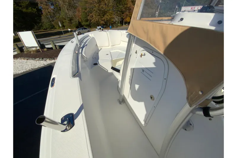 Slide: The Image of 2011 Sea Fox 256 Center Console boat interior with seating and storage compartments. - 18