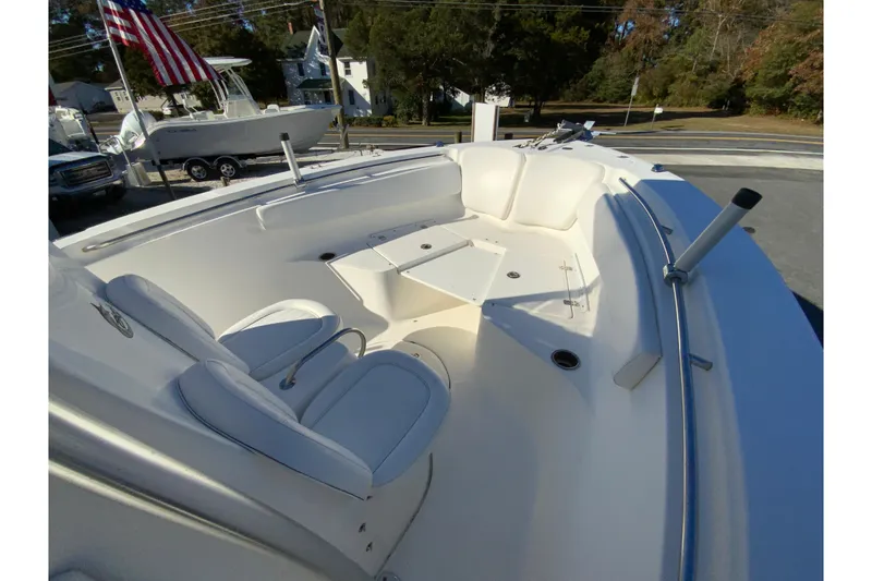 Slide: The Image of 2011 Sea Fox 256 Center Console boat interior with seating and rod holders. - 20