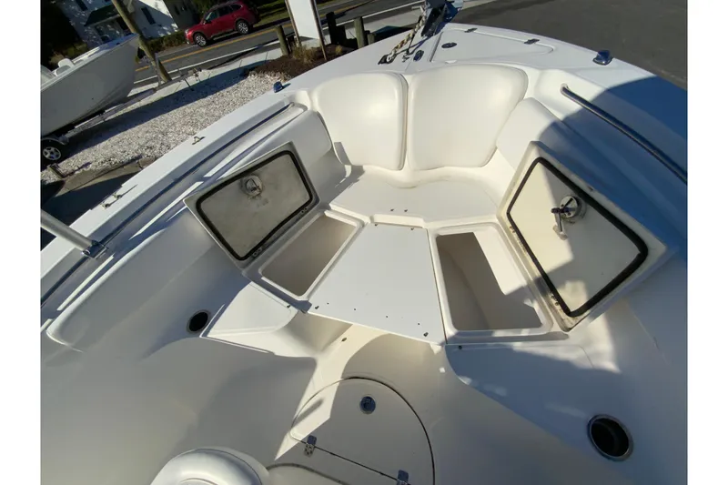Slide: The Image of 2011 Sea Fox 256 Center Console boat with open storage compartments. - 21