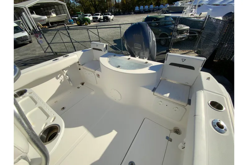Slide: The Image of 2011 Sea Fox 256 Center Console boat interior with seating and storage compartments. - 25