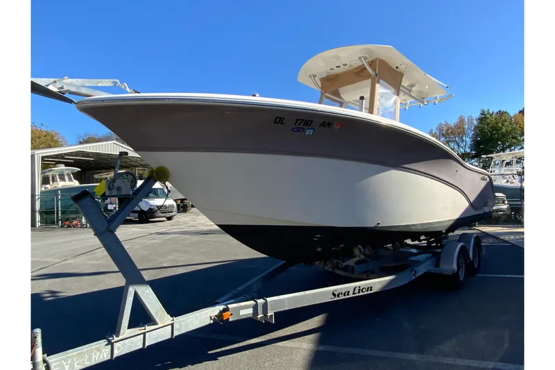 Slide: The Image of 2011 Sea Fox 256 Center Console boat on trailer in outdoor storage area. - 5