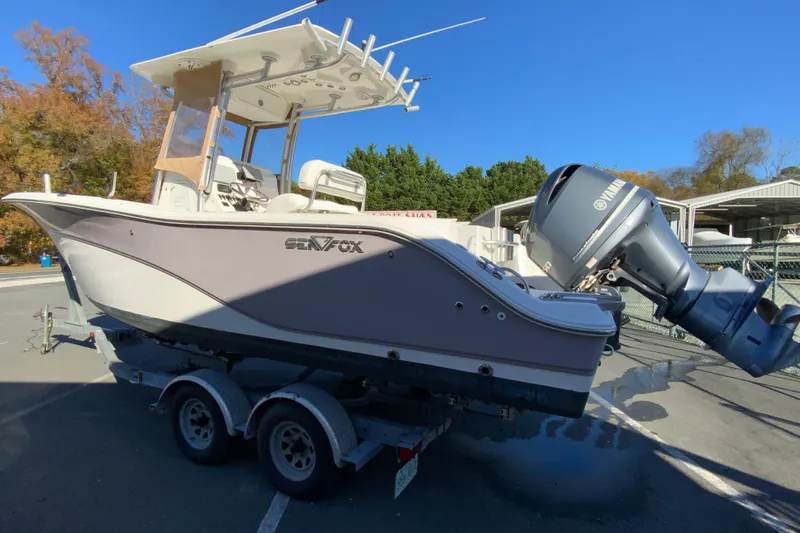 Slide: The Image of 2011 Sea Fox 256 Center Console boat on trailer with Yamaha outboard motor. - 7