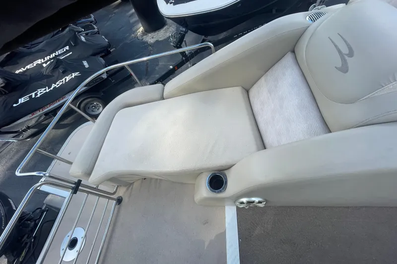 Slide: The Image of 2013 Bennington R22 boat with beige seating and cup holder on deck. - 10