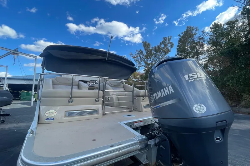 Slide: The Image of 2013 Bennington R22 pontoon boat with Yamaha 150 engine under a clear blue sky. - 17