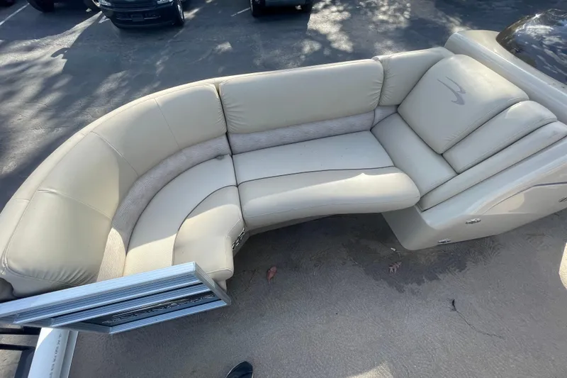 Slide: The Image of 2013 Bennington R22 boat interior with beige cushioned seating. - 5