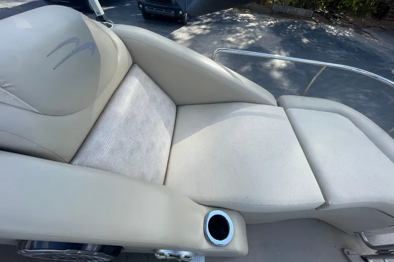 Slide: The Image of Luxurious seating on a 2013 Bennington R22 boat with cup holder and plush cushions. - 9