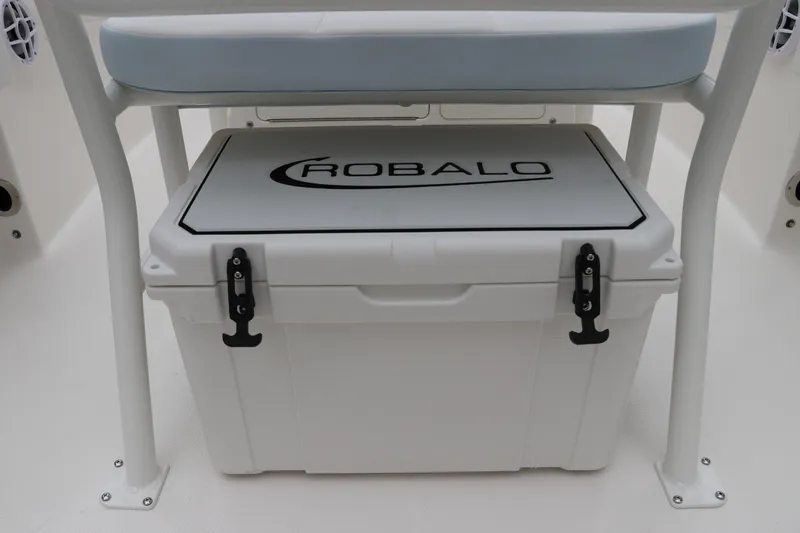 Slide: The Image of 2026 Robalo R180 Center Console boat with branded cooler under seat. - 16