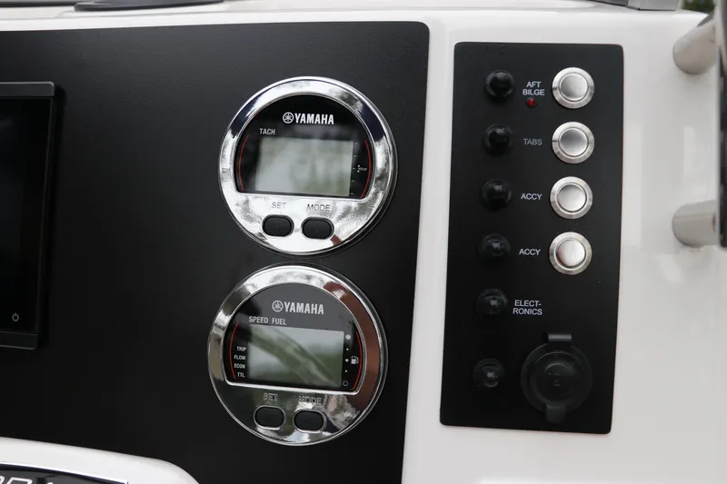 Slide: The Image of 2026 Robalo R180 Center Console dashboard with Yamaha gauges and control panel. - 25