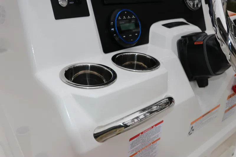 Slide: The Image of 2026 Robalo R180 Center Console dashboard with cup holders and control panel. - 26