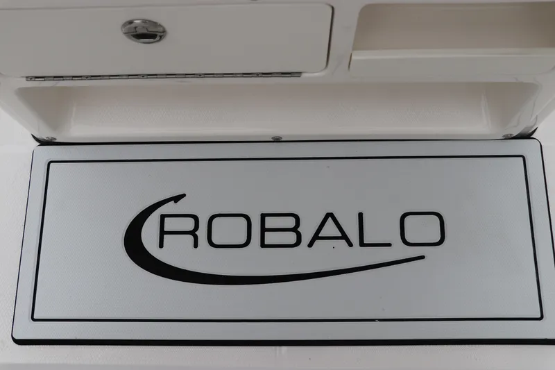 Slide: The Image of 2026 Robalo R180 Center Console boat logo on white panel. - 30