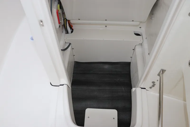 Slide: The Image of 2026 Robalo R180 Center Console interior storage compartment with sleek design and practical features. - 36