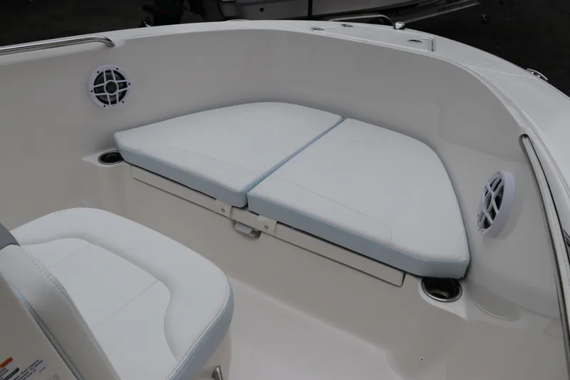 Slide: The Image of 2026 Robalo R180 Center Console boat interior with cushioned seating and speakers. - 37