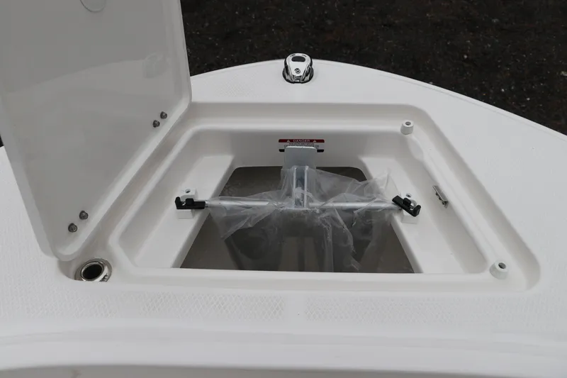 Slide: The Image of 2026 Robalo R180 Center Console boat storage compartment with open hatch. - 41
