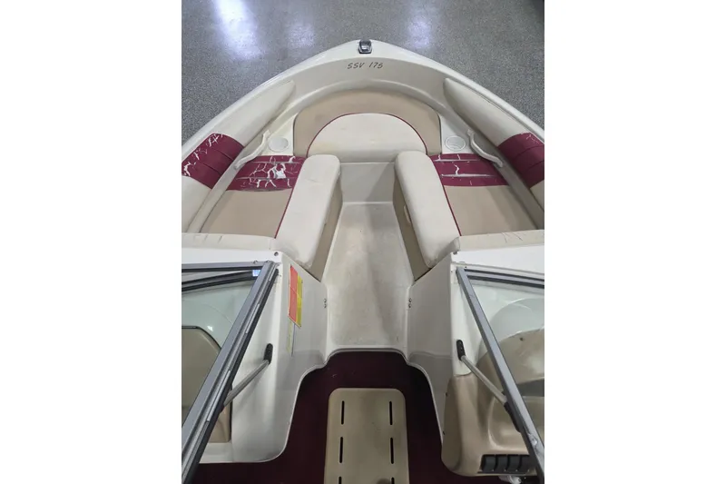 Slide: The Image of 1996 Glastron SX175 boat dashboard with steering wheel and instrument panel. - 4