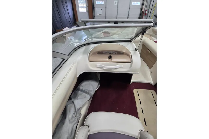 Slide: The Image of 1996 Glastron SX175 boat interior with seating and steering wheel. - 6