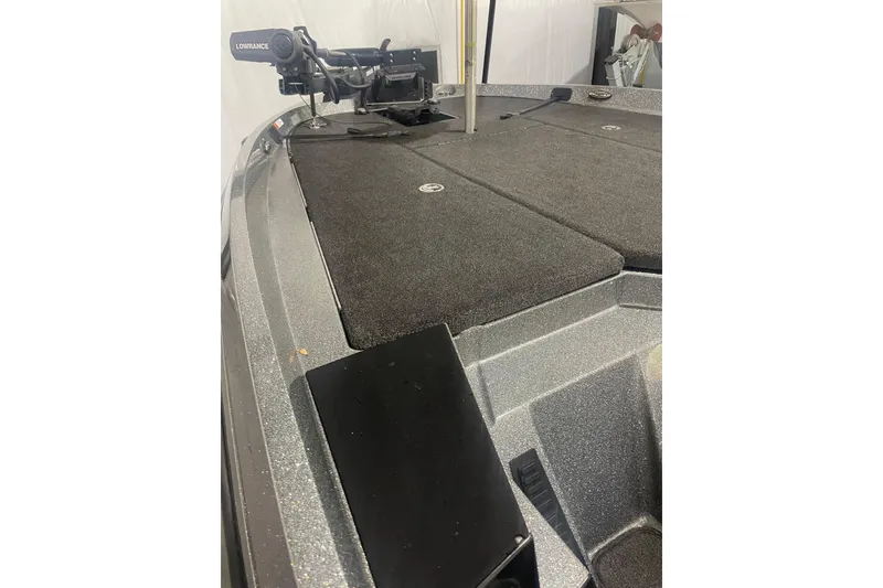 Slide: The Image of 2020 Ranger Z518 boat deck with Lowrance equipment, featuring a spacious, carpeted surface. - 6