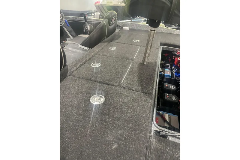Slide: The Image of 2020 Ranger Z518 boat interior with storage compartments and visible wiring. - 7