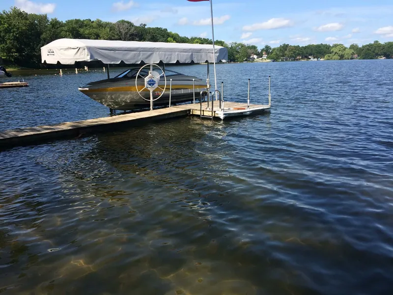 Slide: The Image of 2007 Azure AZ 188 boat docked on a sunny lake. - 3