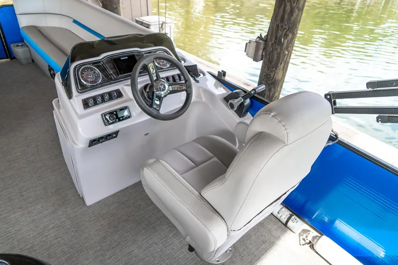 Slide: The Image of 2021 Godfrey Sweetwater 2286 C boat interior with steering console and seating. - 10