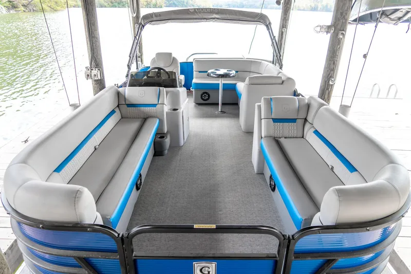 Slide: The Image of 2021 Godfrey Sweetwater 2286 C pontoon boat interior with blue and gray seating. - 16