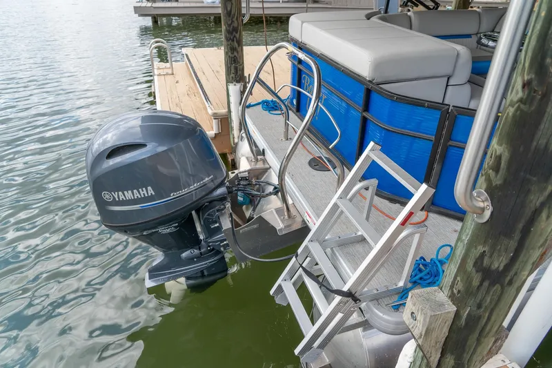 Slide: The Image of 2021 Godfrey Sweetwater 2286 C pontoon boat with Yamaha motor and dock ladder. - 6
