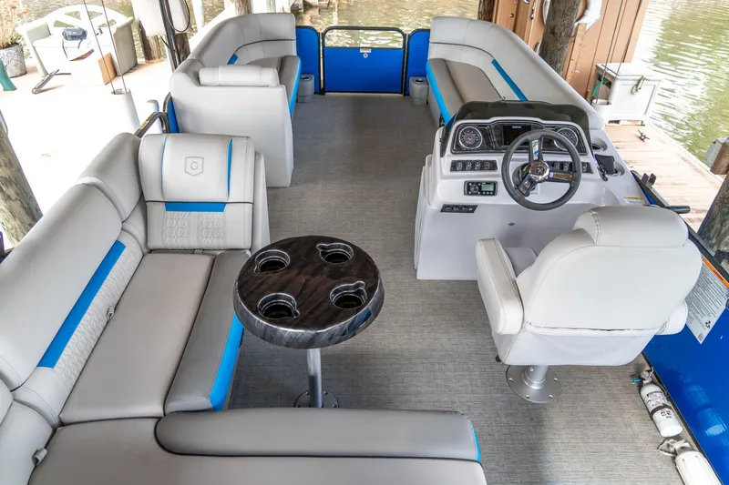 Slide: The Image of Interior of 2021 Godfrey Sweetwater 2286 C pontoon boat with plush seating and steering console. - 8