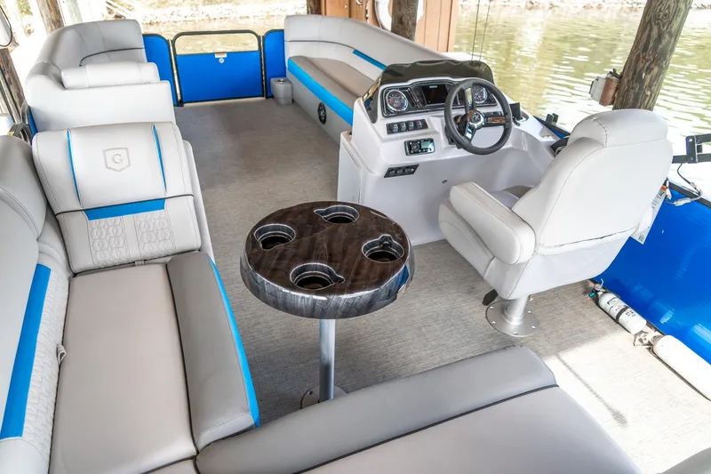 Slide: The Image of Interior of 2021 Godfrey Sweetwater 2286 C pontoon boat with plush seating and steering console. - 9