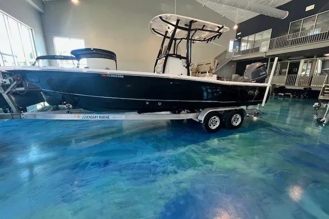 Slide: The Image of 2017 Sea Hunt BX 25 BR boat on trailer in showroom with blue floor. - 0
