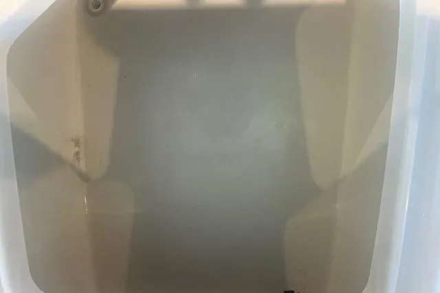 Slide: The Image of 2017 Sea Hunt BX 25 BR boat storage compartment, empty and clean. - 12