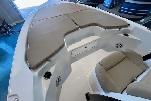 Slide: The Image of 2017 Sea Hunt BX 25 BR boat interior with beige seating and storage compartments. - 13
