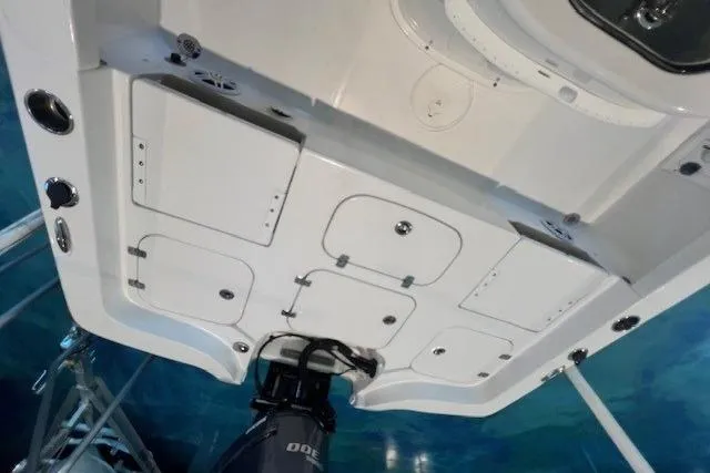 Slide: The Image of 2017 Sea Hunt BX 25 BR boat deck with storage compartments and outboard motor. - 14