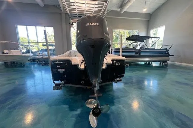 Slide: The Image of 2017 Sea Hunt BX 25 BR boat with 300 HP engine in showroom. - 2