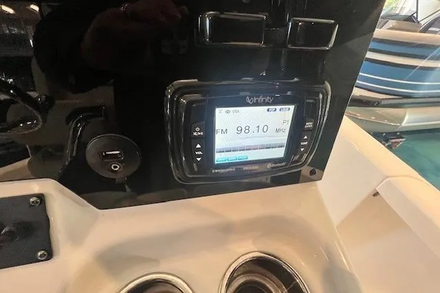 Slide: The Image of 2017 Sea Hunt BX 25 BR boat dashboard with Infinity stereo system displaying FM 98.1 MHz. - 8