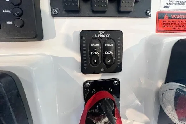 Slide: The Image of Control panel of a 2017 Sea Hunt BX 25 BR boat with Lenco trim tab switches. - 9