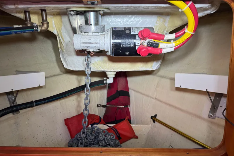 Slide: The Image of Anchor chain locker of 2001 Hinckley Talaria 44 with motor and wiring. - 42