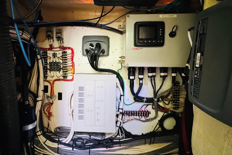 Slide: The Image of Electrical panel and wiring inside a 2001 Hinckley Talaria 44 yacht. - 49