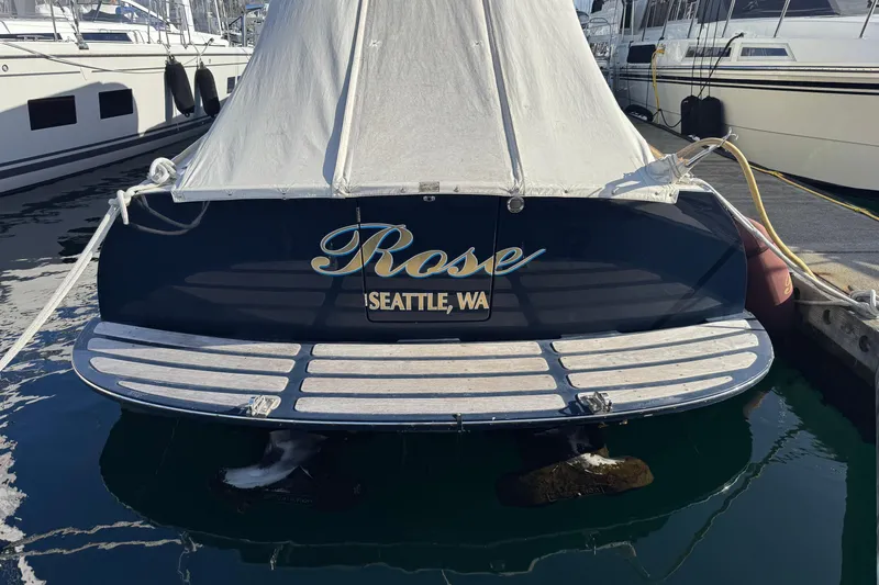 Slide: The Image of Hinckley Talaria 44 boat named "Rose" docked in Seattle, WA, covered and moored. - 12