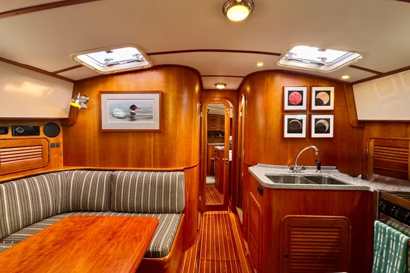 Slide: The Image of Luxurious 2001 Hinckley Talaria 44 yacht interior with wood finish and modern amenities. - 21