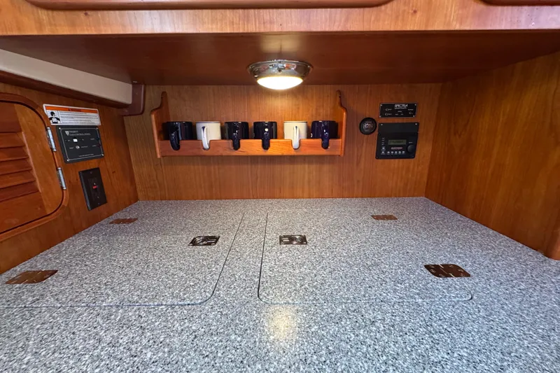 Slide: The Image of Interior of 2001 Hinckley Talaria 44 yacht with wooden cabinetry and countertop. - 27