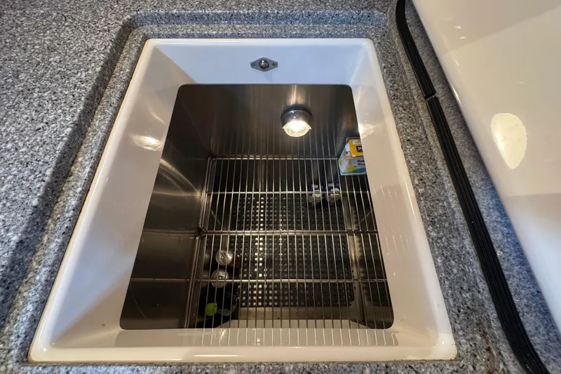 Slide: The Image of Built-in cooler on 2001 Hinckley Talaria 44 yacht with granite countertop. - 29