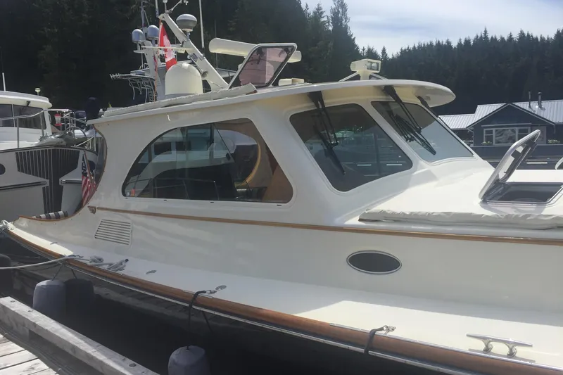 Slide: The Image of 2001 Hinckley Talaria 44 yacht docked, showcasing elegant design and craftsmanship. - 43