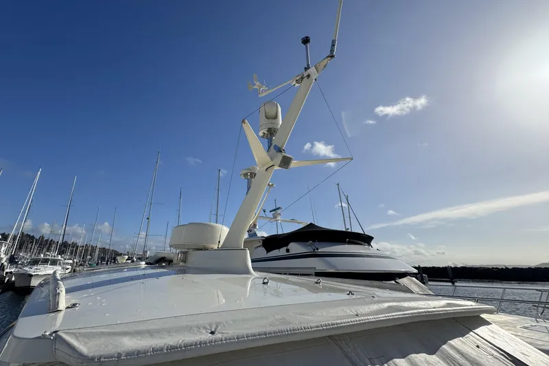 Slide: The Image of 2001 Hinckley Talaria 44 yacht docked under clear blue sky. - 45